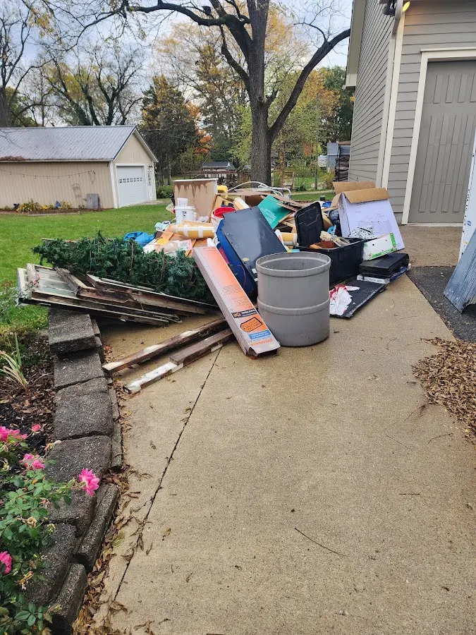 Dumpster being loaded with debris for Residential Dumpster Rental in Buena Vista
